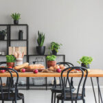 black-chairs-at-wooden-table-with-apples-and-KT9LY62.jpg